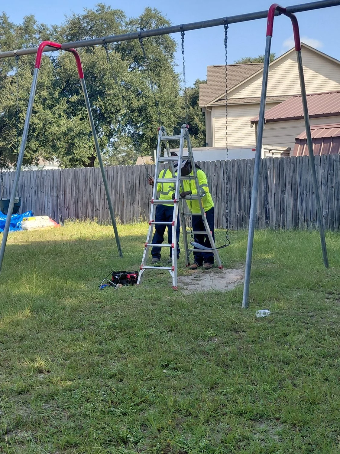 LVJ crew repairing a swing set